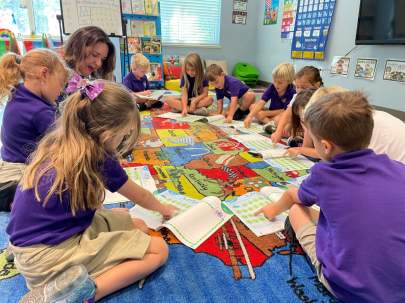 Lower School - CCA Students reading in a circle