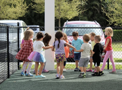 Children holding hands in circle 